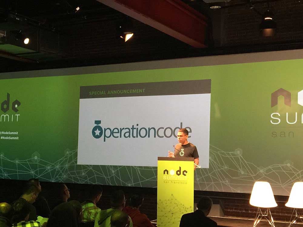 Conrad Hollomon presents in front of the Node Summit 2016 audience.